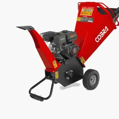 A red Cobra petrol wood chipper with a black engine and pneumatic wheels is shown on a white studio background.