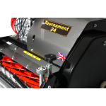 A close-up shows the engine housing and red cutting cylinder of a Tournament 24 lawn mower.