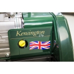 Close-up of the gold Kensington 17B nameplate and a Union Jack sticker on a green mower body.