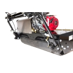 A close-up side view shows the petrol engine and rear roller of a cylinder lawn mower.