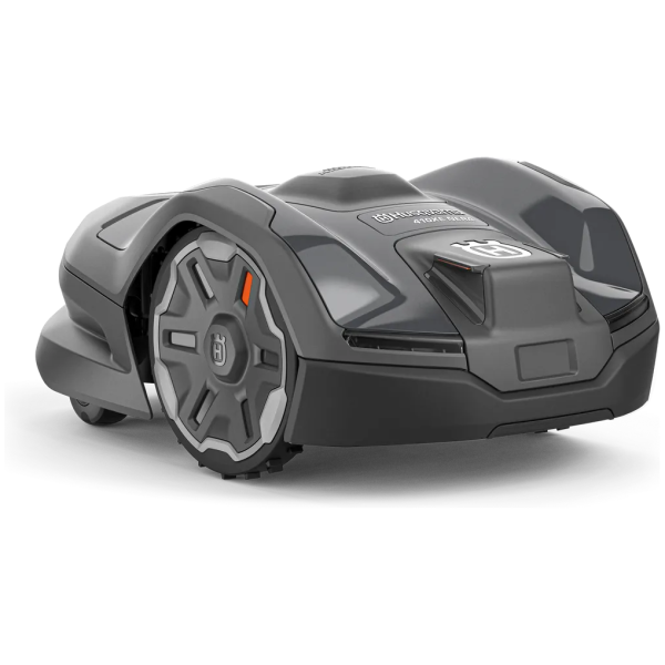 A dark grey Husqvarna 410XE Nera robotic lawn mower is shown at an angle on a plain white studio background.