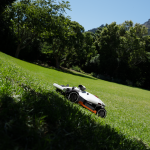 Mammotion LUBA 2 AWD robot lawn mower cutting grass on a steep slope