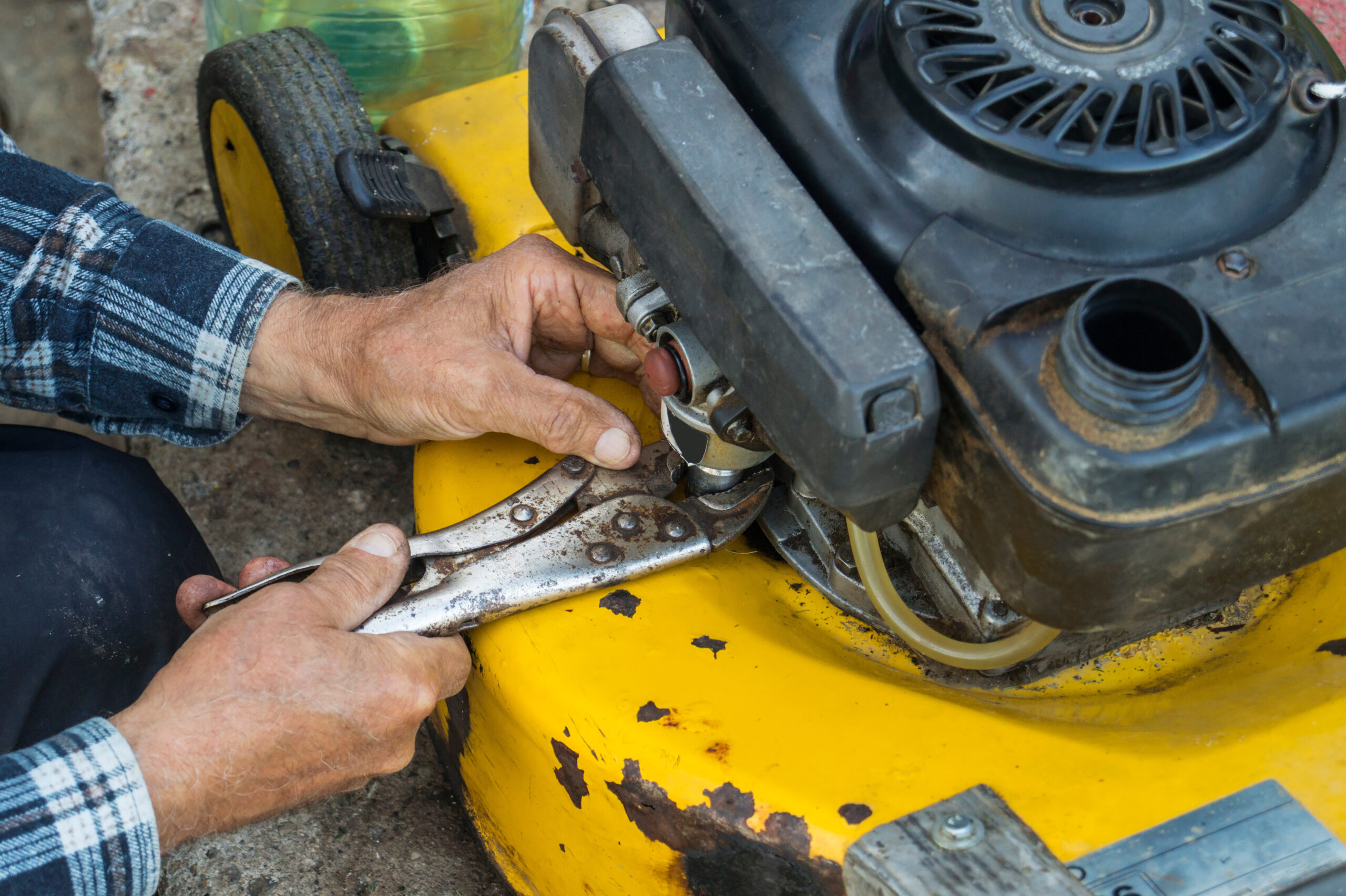repairing lawn mower engine in close up