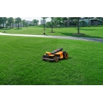 Segway Navimow i110N robot lawn mower mows the green grass.