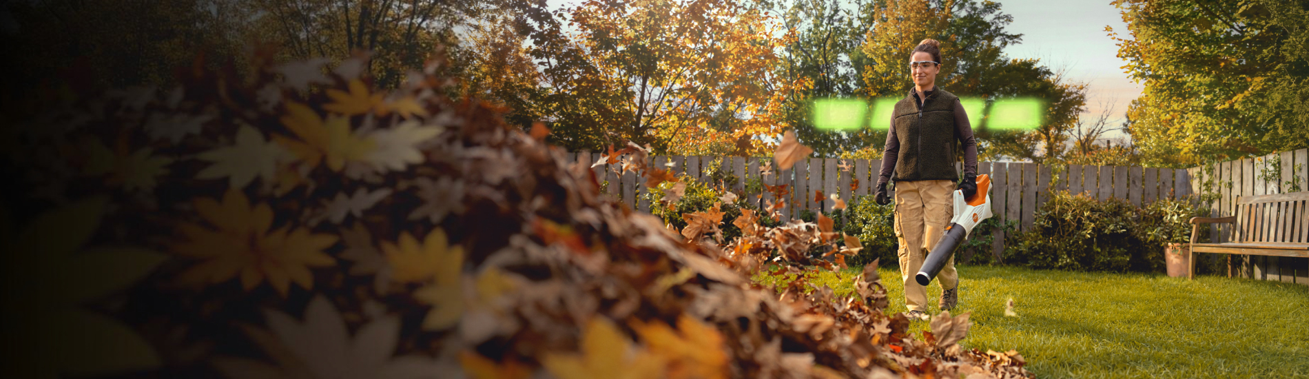 STIHL leaf blower in use in an autumn garden